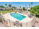 Inviting community pool area with ample seating, lush landscaping, and a relaxing atmosphere for residents at 5209 N 78Th St, Scottsdale, AZ 85250