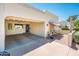 Inviting exterior showcasing a covered carport, shaded front patio, and charming curb appeal at 5209 N 78Th St, Scottsdale, AZ 85250