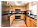 Charming kitchen with stainless steel appliances, wood cabinets, and ample counter space at 5209 N 78Th St, Scottsdale, AZ 85250