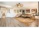 Bright living room featuring wood floors, neutral decor, ample natural light, and comfortable seating at 5209 N 78Th St, Scottsdale, AZ 85250