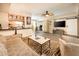 Stylish living room features wood floors, neutral decor, ceiling fan and a view into the dining room at 5209 N 78Th St, Scottsdale, AZ 85250