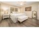 Bright bedroom with white bedding, modern furniture, and an accent tree art above the bed at 5209 N 78Th St, Scottsdale, AZ 85250