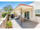Cozy covered patio featuring a grill, lounge chair, and seating area perfect for outdoor relaxation and entertaining at 5209 N 78Th St, Scottsdale, AZ 85250