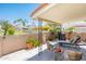 Inviting covered patio with stylish furniture, lush greenery, and a relaxing ambiance for outdoor enjoyment at 5209 N 78Th St, Scottsdale, AZ 85250