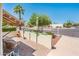 Serene patio area featuring desert landscaping, a charming umbrella, and inviting outdoor seating at 5209 N 78Th St, Scottsdale, AZ 85250