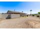 This property boasts a backyard with gravel, block fencing, and mature landscaping at 5902 W Orange Dr, Glendale, AZ 85301