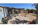 Outdoor backyard with covered patio and a mix of concrete and dirt landscaping with space for outdoor activities at 604 W Emelita Ave, Mesa, AZ 85210
