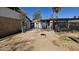 Backyard area features a covered patio, partial dirt landscaping, and potential for creating an outdoor living space at 604 W Emelita Ave, Mesa, AZ 85210
