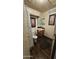 Modest bathroom with a sink, toilet, vanity, and wall art adding a touch of personal style to the space at 604 W Emelita Ave, Mesa, AZ 85210