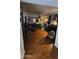 Spacious living room featuring hardwood floors, multiple seating areas, and vintage decor, awaiting personal touches at 604 W Emelita Ave, Mesa, AZ 85210