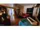 Bright living room with hardwood floors, ample seating, and natural light offering a comfortable living space at 604 W Emelita Ave, Mesa, AZ 85210