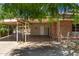 View of a covered carport area, adjacent to a brick home, providing ample sheltered parking at 6100 N 36Th Ave, Phoenix, AZ 85019