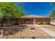 Charming brick home featuring mature trees, a well-manicured lawn, and a 'no trespassing' sign at 6100 N 36Th Ave, Phoenix, AZ 85019