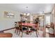 Well-lit dining room with an oval table and adjacent to the kitchen at 67 W Sarah Ln, Tempe, AZ 85284