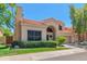Beautiful home with a well-maintained lawn, mature trees, and tile roof at 67 W Sarah Ln, Tempe, AZ 85284