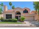 Charming two-story home featuring a landscaped yard and a two-car garage at 67 W Sarah Ln, Tempe, AZ 85284