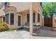 Inviting front porch with a bench and decorative table, offering a welcoming entrance at 67 W Sarah Ln, Tempe, AZ 85284