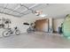 Spacious garage provides ample storage with built in brown cabinets and room for bikes at 67 W Sarah Ln, Tempe, AZ 85284