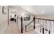 Open hallway showcasing a staircase, chandelier, artwork, and architectural details at 67 W Sarah Ln, Tempe, AZ 85284