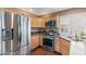 Modern kitchen with stainless steel appliances and ample counter space at 67 W Sarah Ln, Tempe, AZ 85284