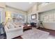 Inviting living room with a fireplace, large windows, and plush seating at 67 W Sarah Ln, Tempe, AZ 85284