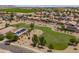 Aerial view of neighborhood featuring single-Gathering homes, solar panels, and desert landscaping at 6944 S Morning Dew Ln, Buckeye, AZ 85326