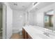 Bathroom with a bathtub and shower combo, plus large vanity with sink and counter space at 6944 S Morning Dew Ln, Buckeye, AZ 85326