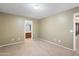 Bedroom with neutral carpet, ensuite bathroom, and spacious layout for relaxation at 6944 S Morning Dew Ln, Buckeye, AZ 85326