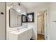 Modern bathroom with double sinks, vanity mirror with contemporary lighting and shower-tub combination at 7625 E Camelback Rd # B226, Scottsdale, AZ 85251