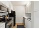 Galley kitchen with modern, stainless steel appliances, sleek cabinets, and laminate countertop at 7625 E Camelback Rd # B226, Scottsdale, AZ 85251