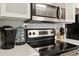 Well-maintained kitchen featuring modern stainless steel appliances, light countertops, and sleek cabinets at 7625 E Camelback Rd # B226, Scottsdale, AZ 85251