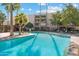 Large community pool surrounded by lush landscaping, providing a resort-like atmosphere at 7625 E Camelback Rd # B226, Scottsdale, AZ 85251