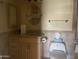 Functional bathroom featuring a vanity with storage and updated toilet at 7637 E Thornwood Dr, Scottsdale, AZ 85251