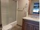 Bathroom featuring a walk-in shower and a vanity with ample storage space at 7637 E Thornwood Dr, Scottsdale, AZ 85251