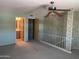 Large bedroom featuring green walls, patterned wallpaper, and a ceiling fan at 7637 E Thornwood Dr, Scottsdale, AZ 85251