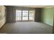Bright living room featuring sliding glass doors and original details offering a seamless connection to the outdoors at 7637 E Thornwood Dr, Scottsdale, AZ 85251