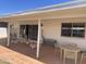 Covered outdoor patio with tile flooring and outdoor seating at 7637 E Thornwood Dr, Scottsdale, AZ 85251