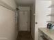 Utility room featuring wall hooks and paint storage on shelving at 7637 E Thornwood Dr, Scottsdale, AZ 85251
