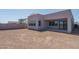 Home's backyard featuring a neutral color scheme with patio space and low-maintenance landscaping at 7956 W Griswold Rd, Peoria, AZ 85345