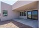 Backyard patio featuring a covered outdoor area with sliding glass doors and modern design at 7956 W Griswold Rd, Peoria, AZ 85345