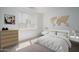 Bright bedroom featuring a world map decoration, dresser, and bedside tables for a clean, contemporary feel at 7956 W Griswold Rd, Peoria, AZ 85345
