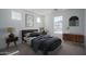 Bedroom with modern furnishings, a large window, and neutral decor at 7956 W Griswold Rd, Peoria, AZ 85345