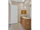 Bright bathroom featuring granite counters, a large mirror, and plenty of storage space at 8031 W Morten Ave, Glendale, AZ 85303