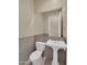 Half bathroom with tile flooring and a pedestal sink at 8031 W Morten Ave, Glendale, AZ 85303