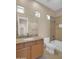 Bathroom vanity with granite countertops, tile floors, and shower-tub combo at 8031 W Morten Ave, Glendale, AZ 85303