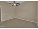 Neutral bedroom featuring carpet flooring and ceiling fan at 8031 W Morten Ave, Glendale, AZ 85303