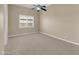 Neutral bedroom featuring carpet flooring and ceiling fan at 8031 W Morten Ave, Glendale, AZ 85303