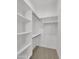 Walk-in closet featuring ample shelving and clothing racks at 8031 W Morten Ave, Glendale, AZ 85303