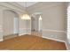 Dining room showcases hardwood floors and decorative chandeliers, seamlessly flowing into other rooms at 8031 W Morten Ave, Glendale, AZ 85303