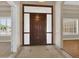 Elegant foyer with tile flooring and views of the front door and living spaces at 8031 W Morten Ave, Glendale, AZ 85303